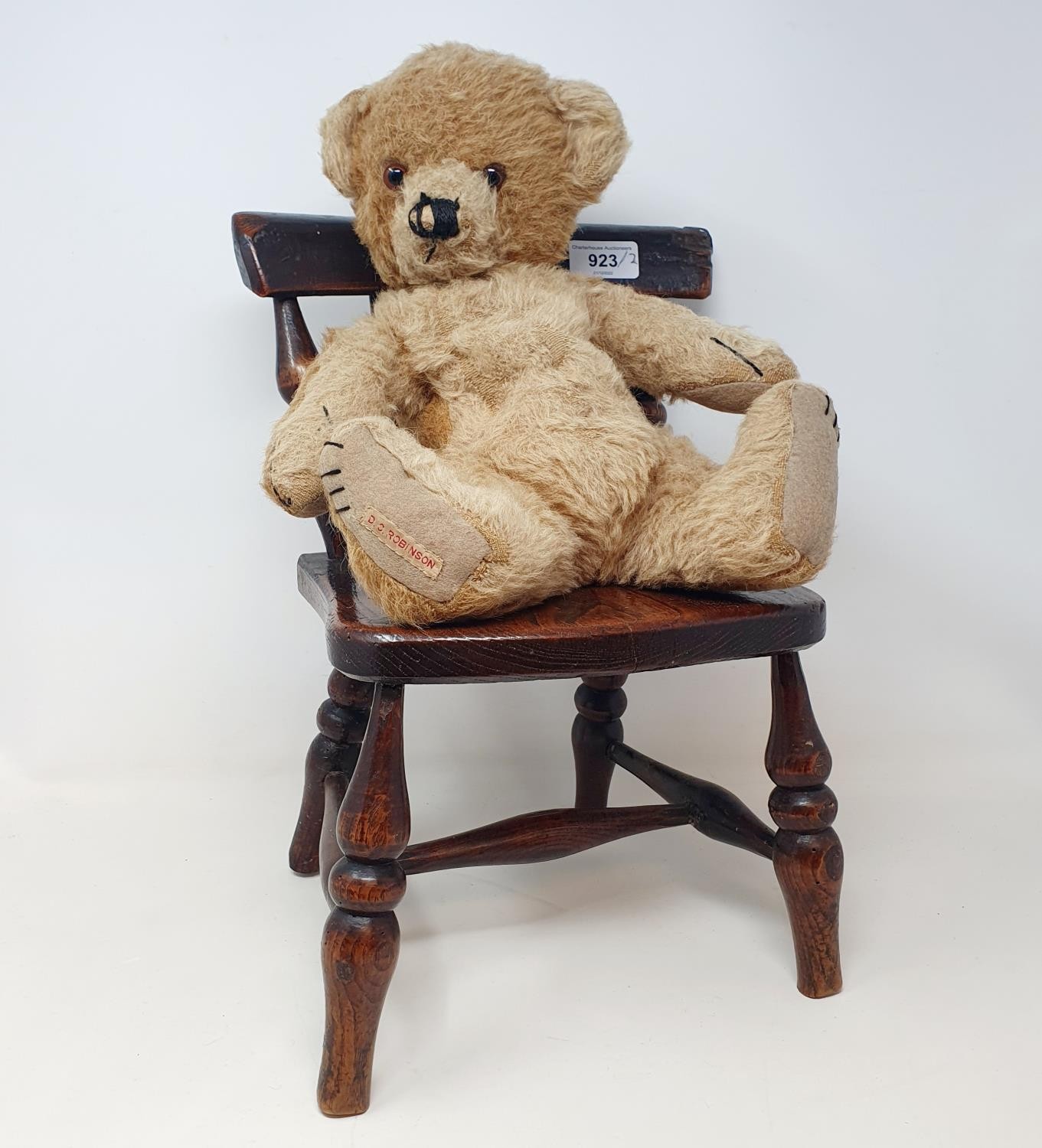 A late 19th/early 20th century child's elm stick back chair, on turned legs joined by an H