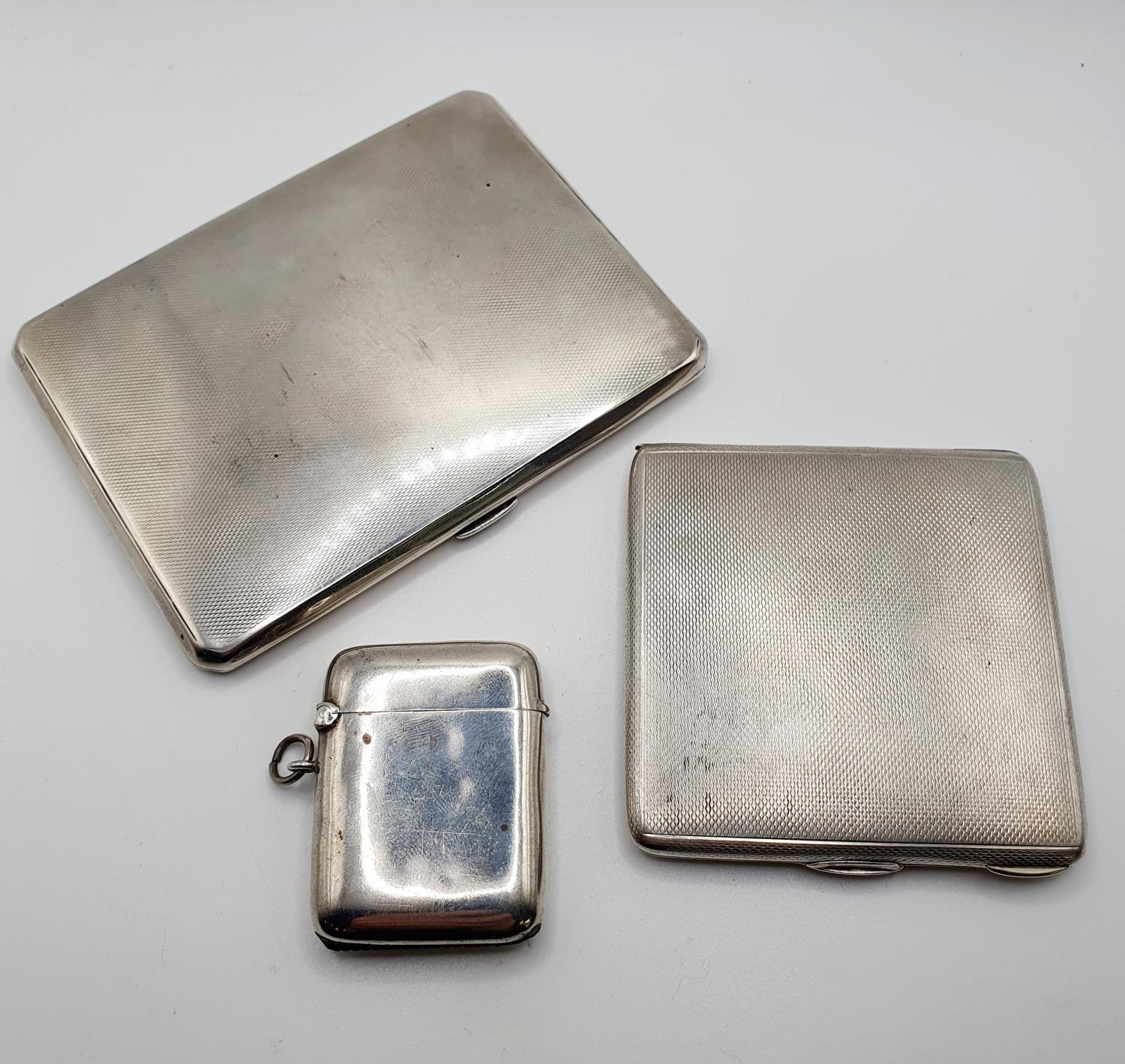 A George V silver cigarette case, interior inscribed Xmas 1935, a silver compact, and a vesta, - Image 3 of 3