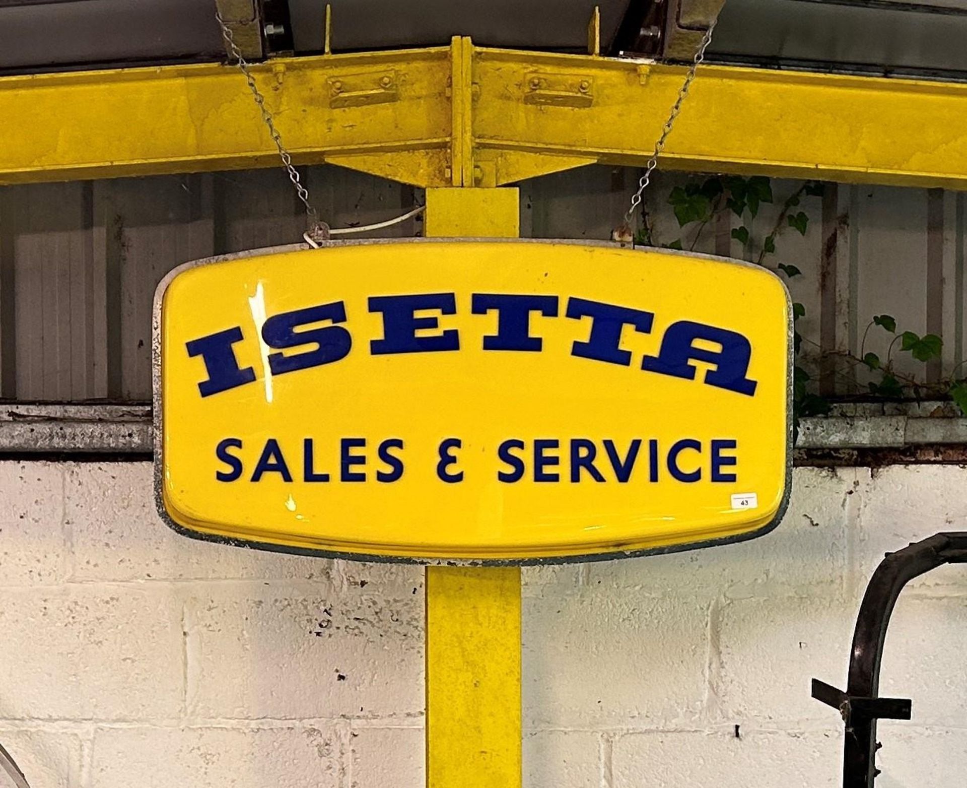 An Isetta Sales & Service hanging garage sign, generally good condition, two small star type