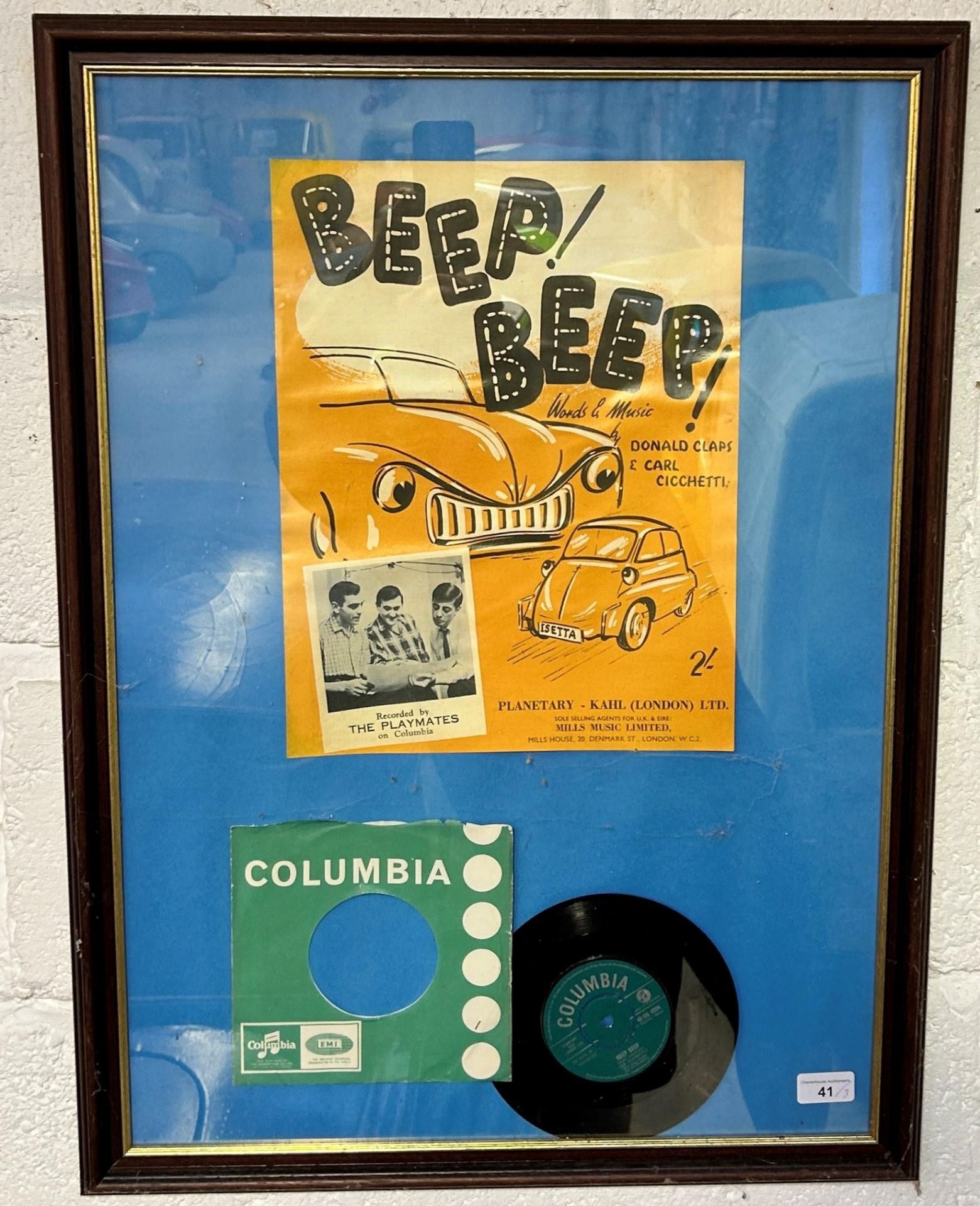A 45 rpm record, Beep Beep by The Palymates, framed with a promotional poster featuring an Isetta, a