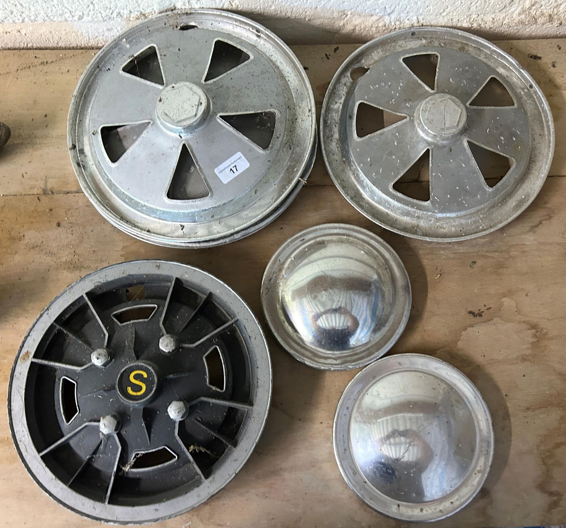 A group of assorted hub caps Being sold without reserve