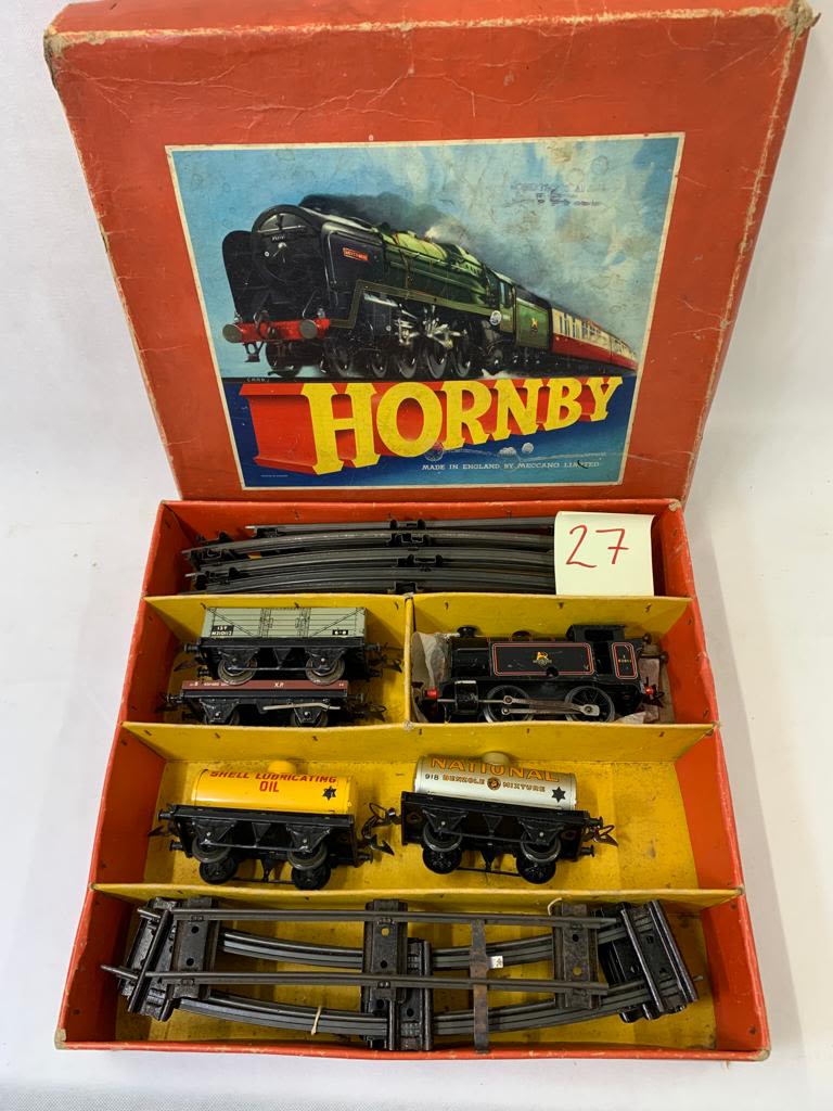 Hornby O Gauge clockwork goods set with tank engine 82011 in black. 2 petrol wagons, open goods plus