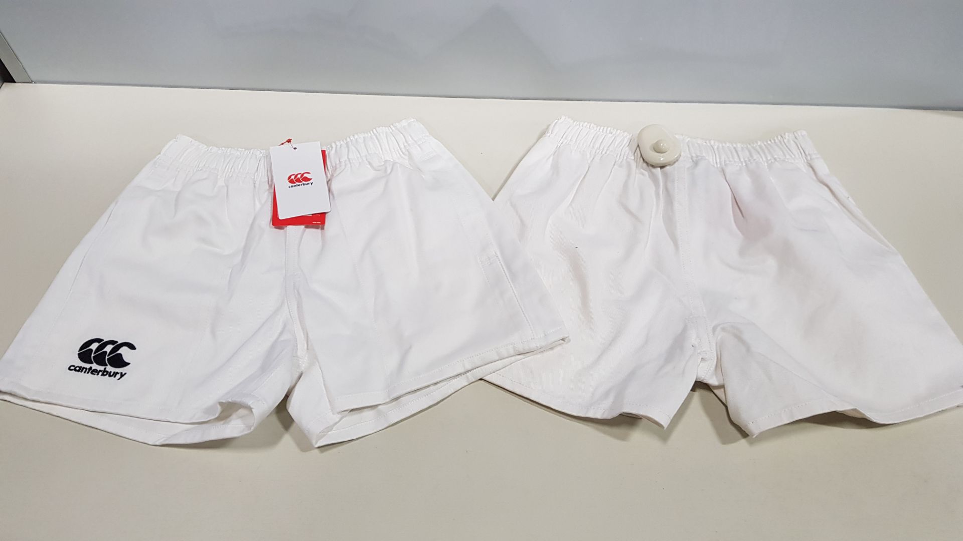 15 X BRAND NEW CANTERBURY SHORTS IN WHITE SIZE 9-10 YEARS (PICK LOOSE) - NOTE SOME SECURITY TAGGED