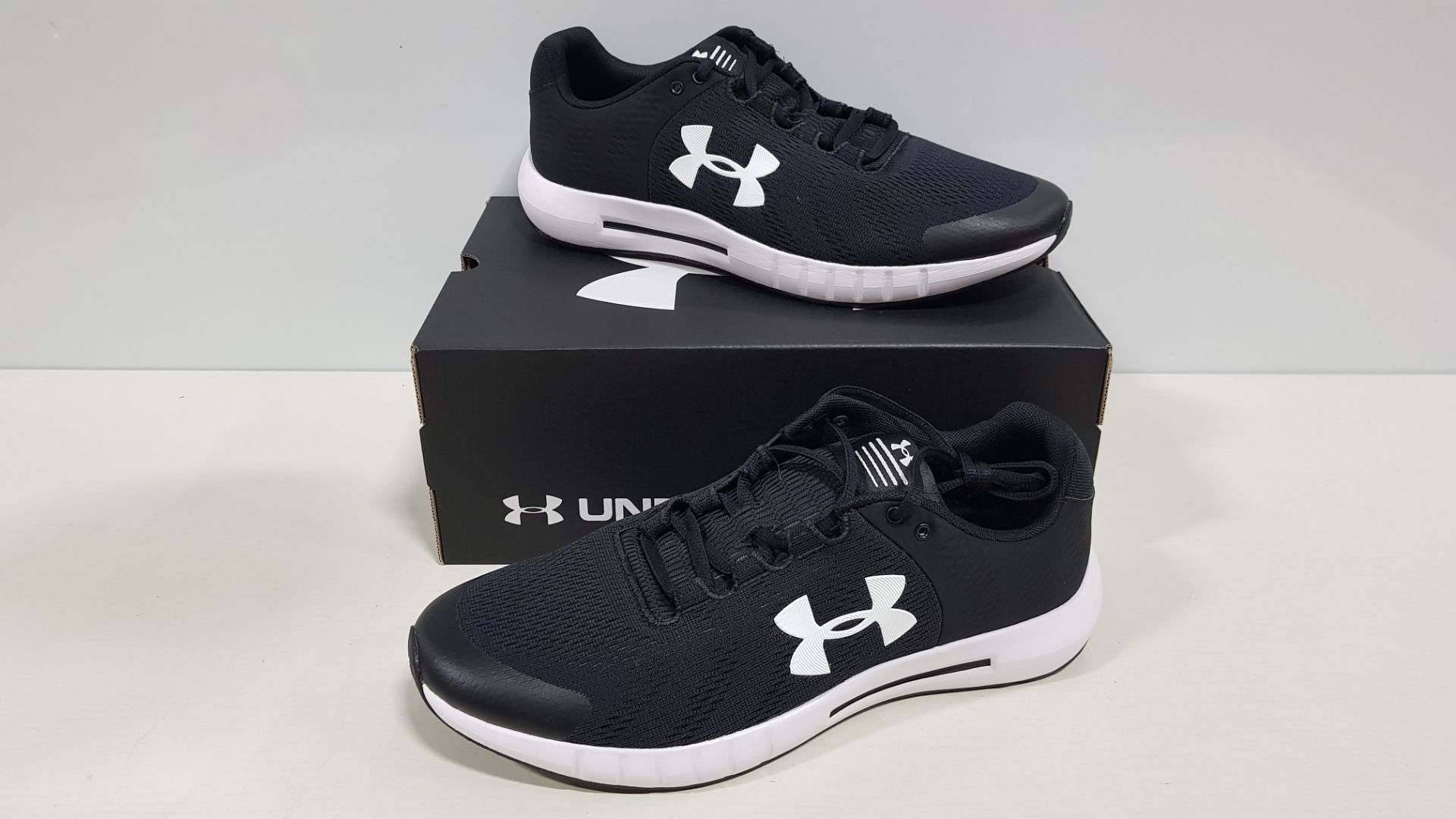 9 X BRAND NEW UNDER ARMOR MICRO G PURSUIT IN BLACK AND WHITE - SIZE UK 9