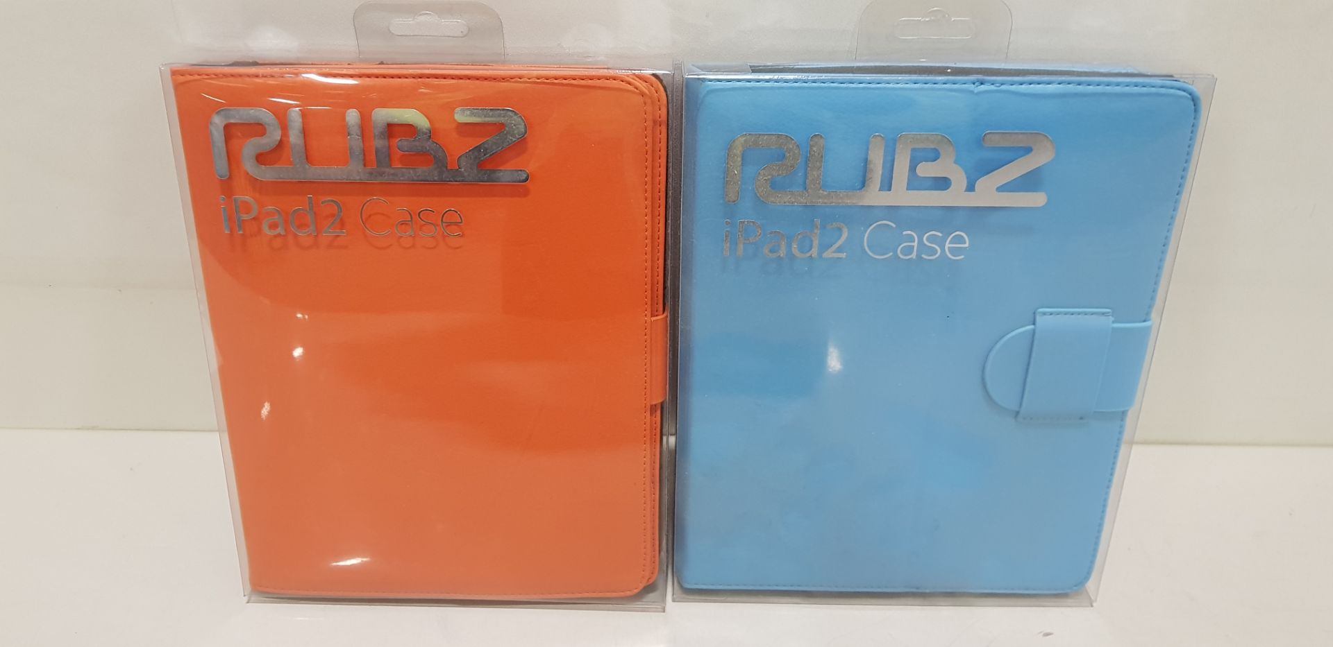 240 X BRAND NEW RUBZ IPAD CASES IN COLOURS ( ORANGE AND BLUE )