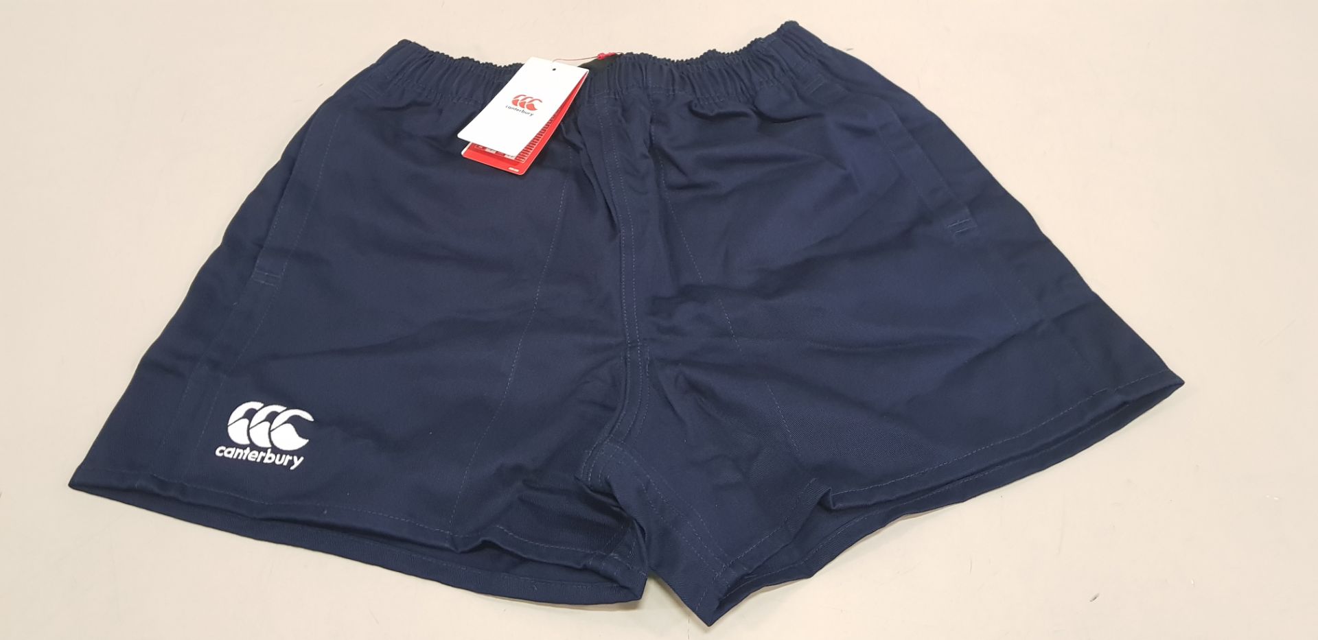 40 X BRAND NEW CANTERBURY NAVY SHORTS (SIZE M) - IN ONE BAG