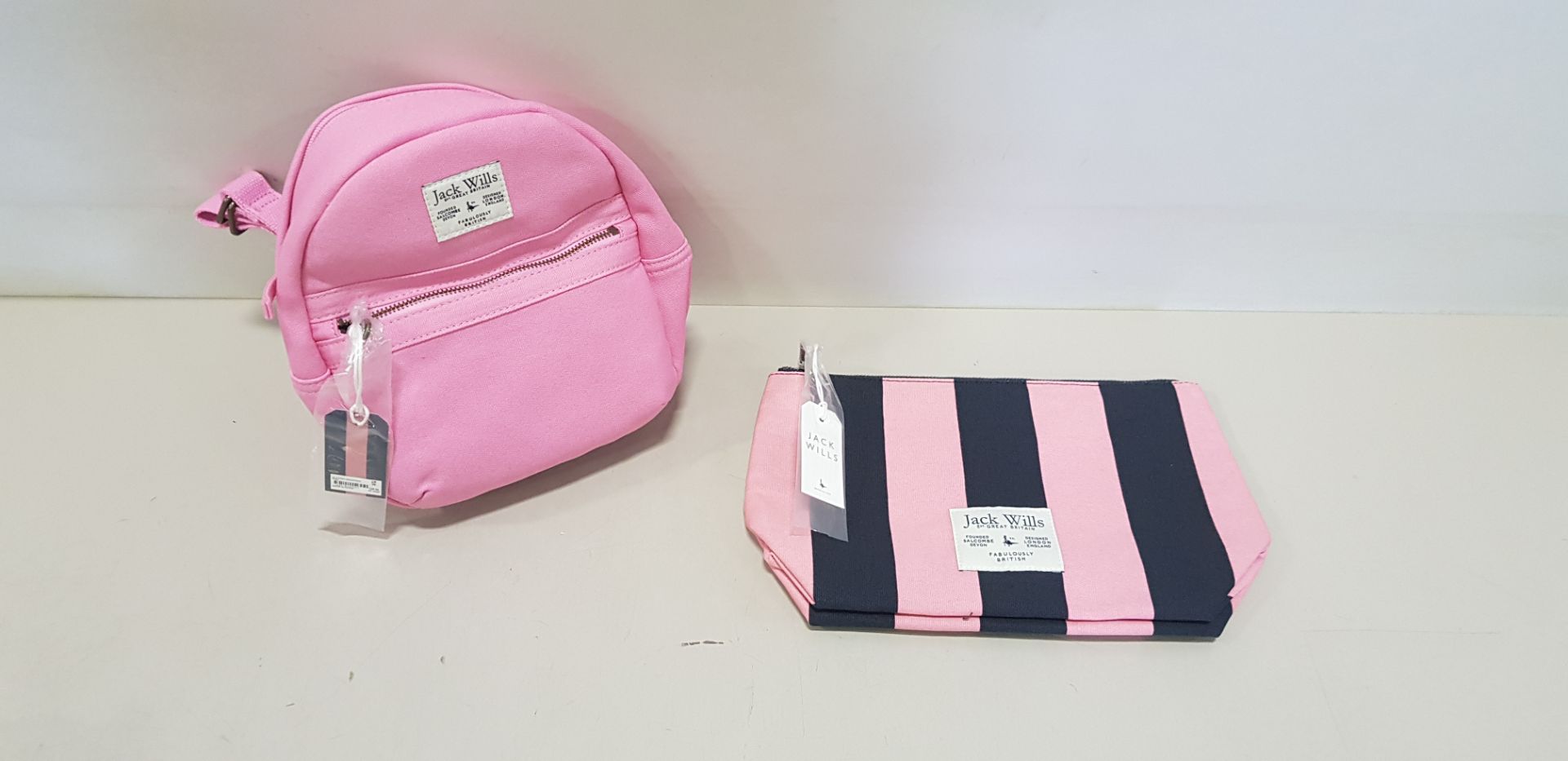 7 X BRAND NEW JACK WILLS BAGS INCLUDING 3 X HAYLE PINK POUCHES AND 4 X ELSTREE PINK BACKPACKS - IN 1