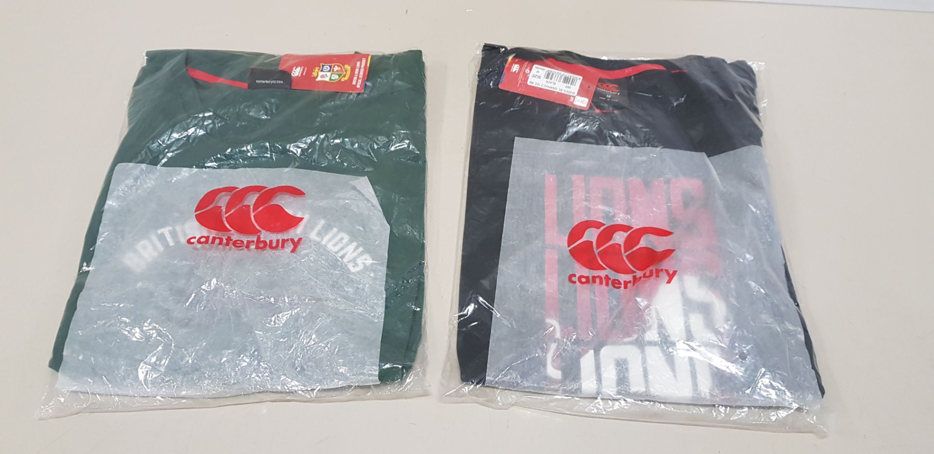26 X BRAND NEW CANTERBURY T-SHIRTS (6 X GREEN (XL) AND 20 X BLACK (M)) - IN 2 BAGS