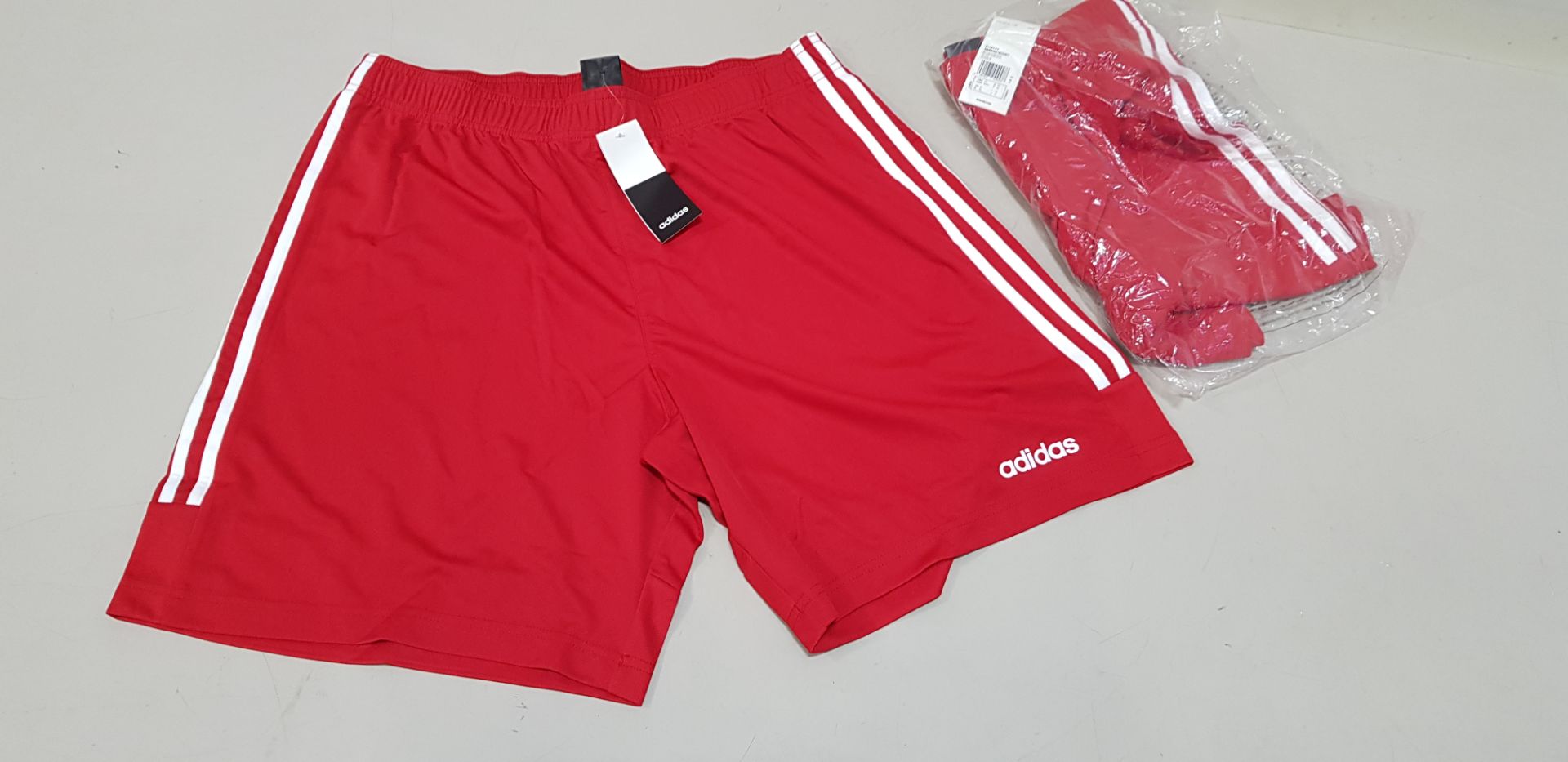 27 X BRAND NEW ADIDAS RED SERENO 3 STRIPE SHORTS IN SIZE UK MEDIUM