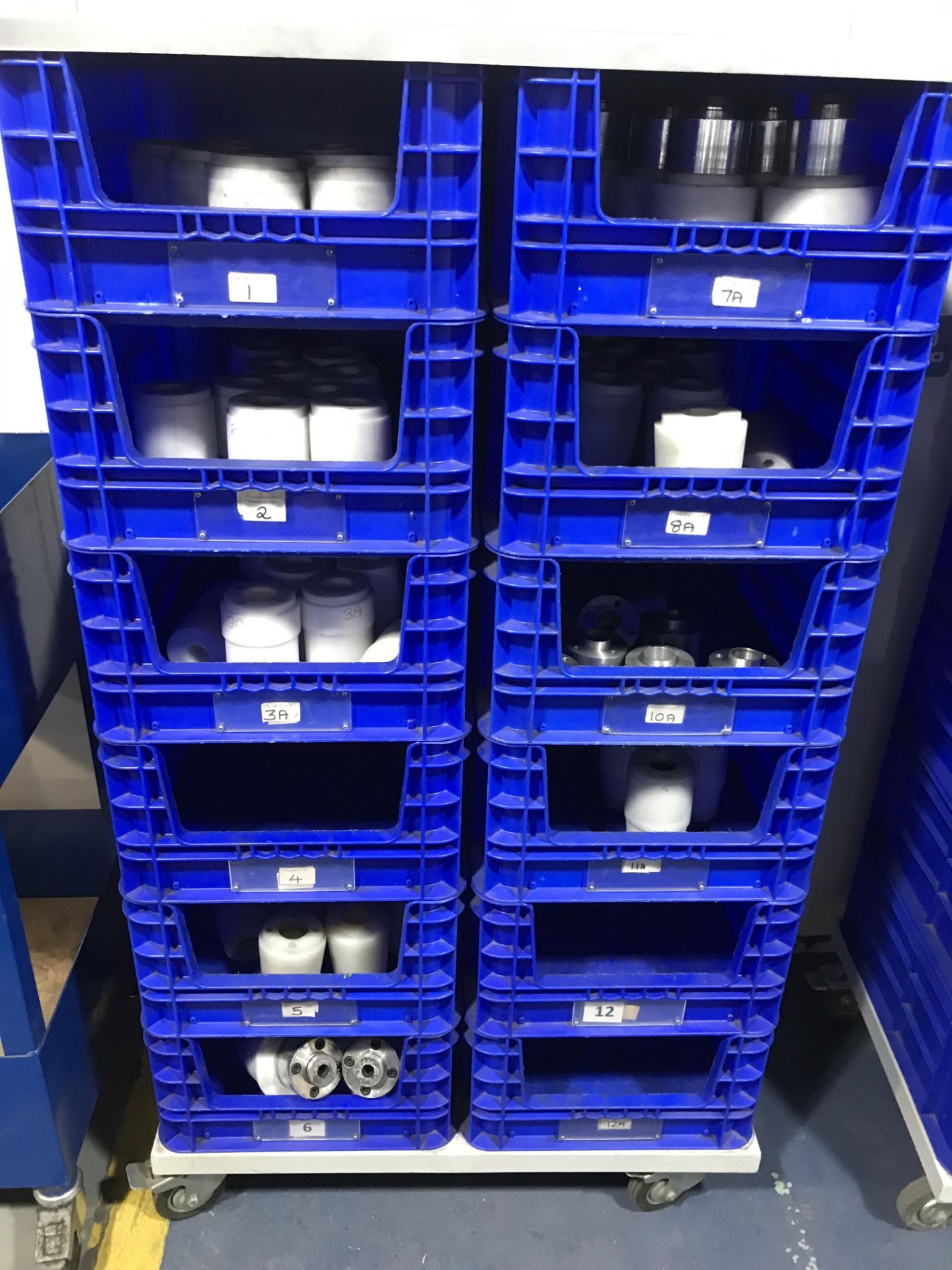 MOBILE 12-WAY BLUE PLASTIC BIN STORAGE UNIT AND CONTENTS OF PAGO MANDRELS