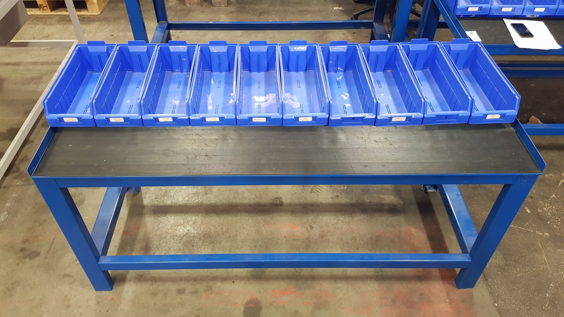 1 X INDUSTRIAL WORK BENCH. COMES WITH 10 BLUE TRAYS. OVERALL DIMENSIONS 180x66x80cm