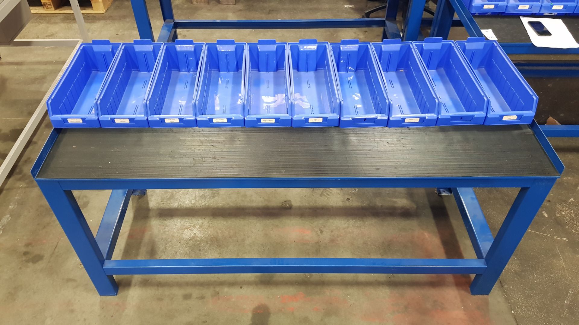 1 X INDUSTRIAL WORK BENCH. COMES WITH 10 BLUE TRAYS. OVERALL DIMENSIONS 180x66x80cm