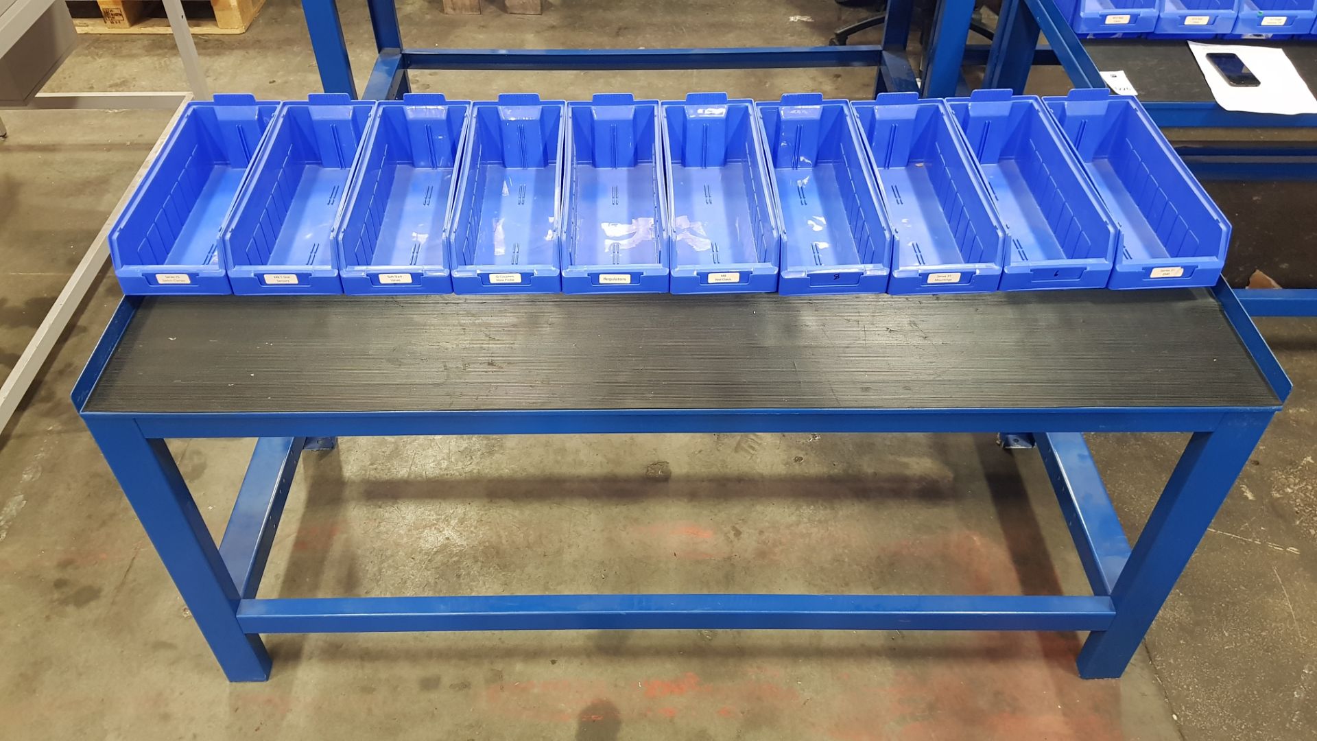 1 X INDUSTRIAL WORK BENCH. COMES WITH 10 BLUE TRAYS. OVERALL DIMENSIONS 180x66x80cm