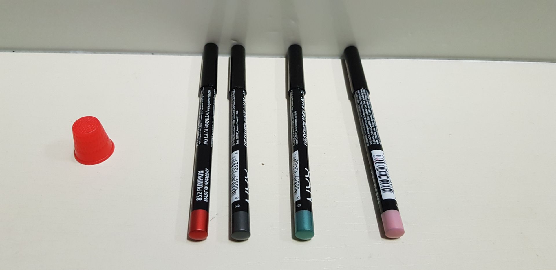 100 PIECE MIXED NYX LIP PENCIL AND EYEBROW PENCIL LOT CONTAINING PUMPKIN LIP PENCIL, FLOWER LIP