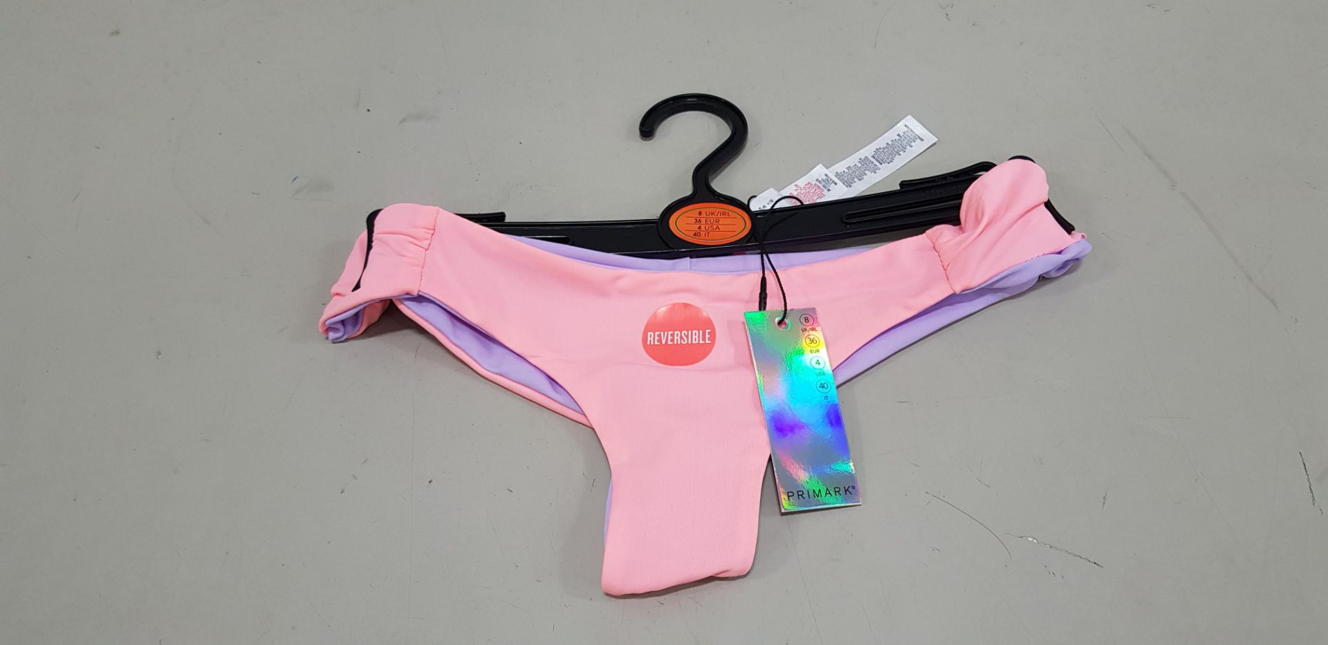 120 X BRAND NEW PRIMARK REVERSIBLE CORAL AND LILAC BIKINI BOTTOMS IN ALL RATIO SIZES 6-18 RRP €5.