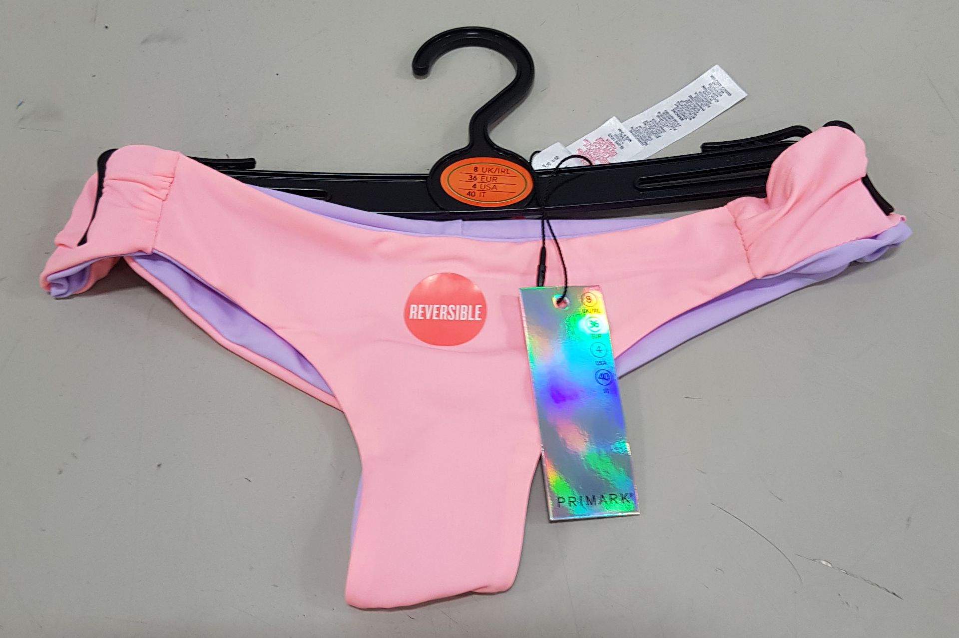 120 X BRAND NEW PRIMARK REVERSIBLE CORAL AND LILAC BIKINI BOTTOMS - INCLUDES ALL SIZES 6 -18 UK