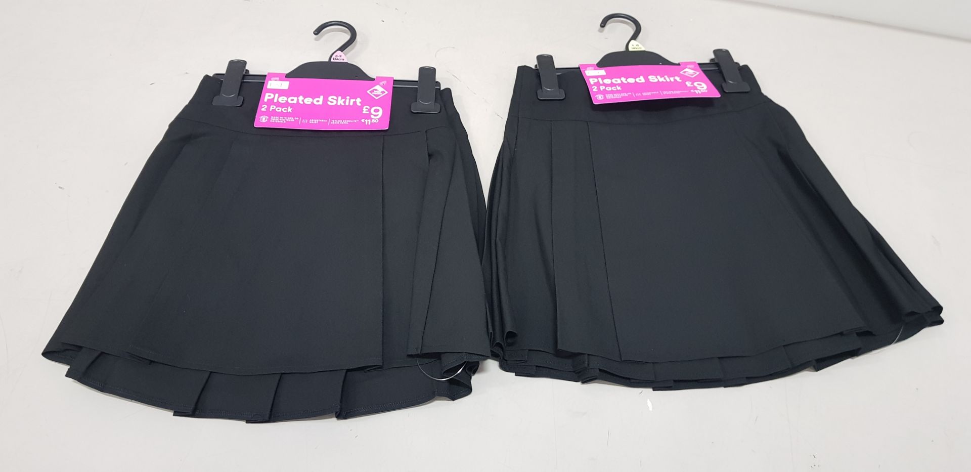 55 X BRAND NEW F&F PACKS OF 2 GIRLS PLEATED SKIRTS ALL IN BLACK IN VARIOUS SIZES TO INCLUDE ( 4-5