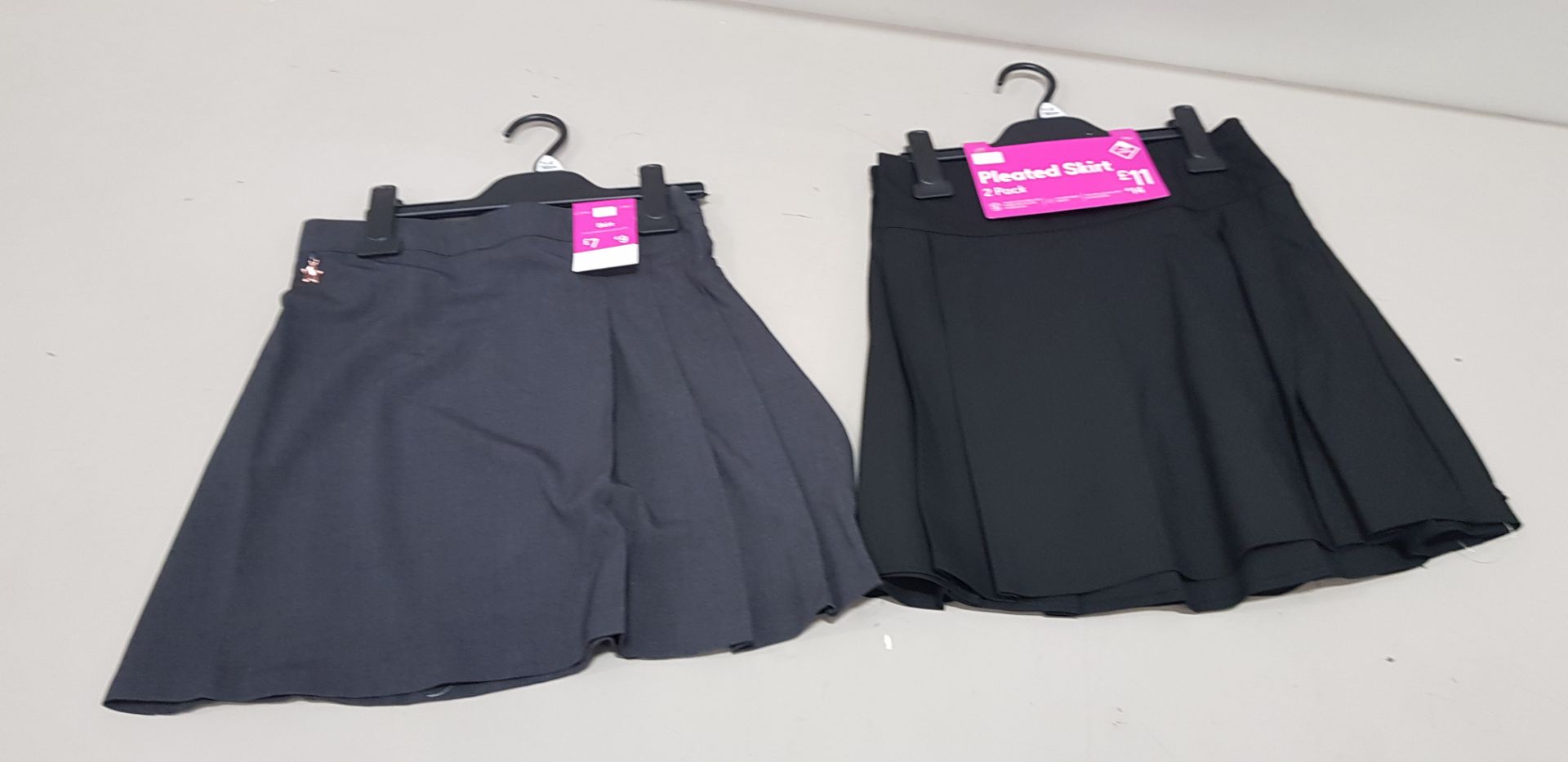 56 X MIXED SKIRT LOT TO INCLUDE 23 X BRAND NEW F&F PACKS OF 2 PLEATED SKIRTS ALL IN GREY ALL IN
