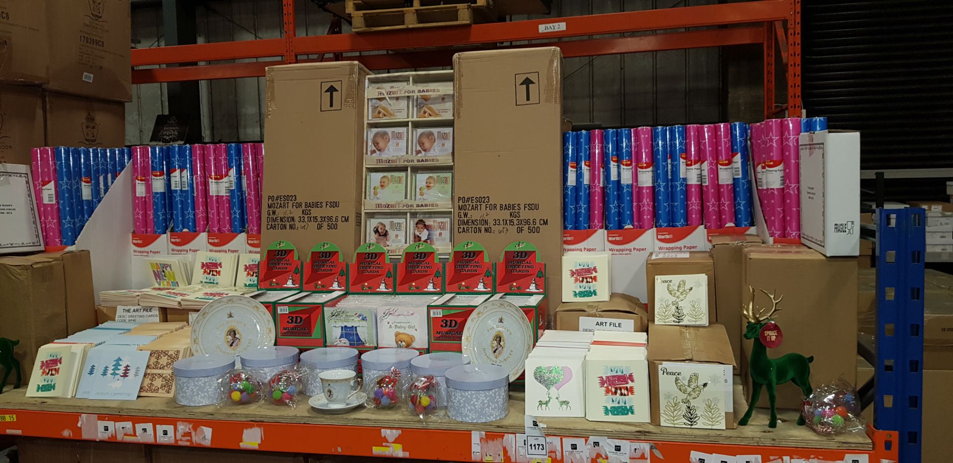 FULL BAY BRAND NEW MIXED LOT CONTAINING LARGE AMOUNT OF WOOLWORTHS WRAPPING PAPER, STAND OF MOSART