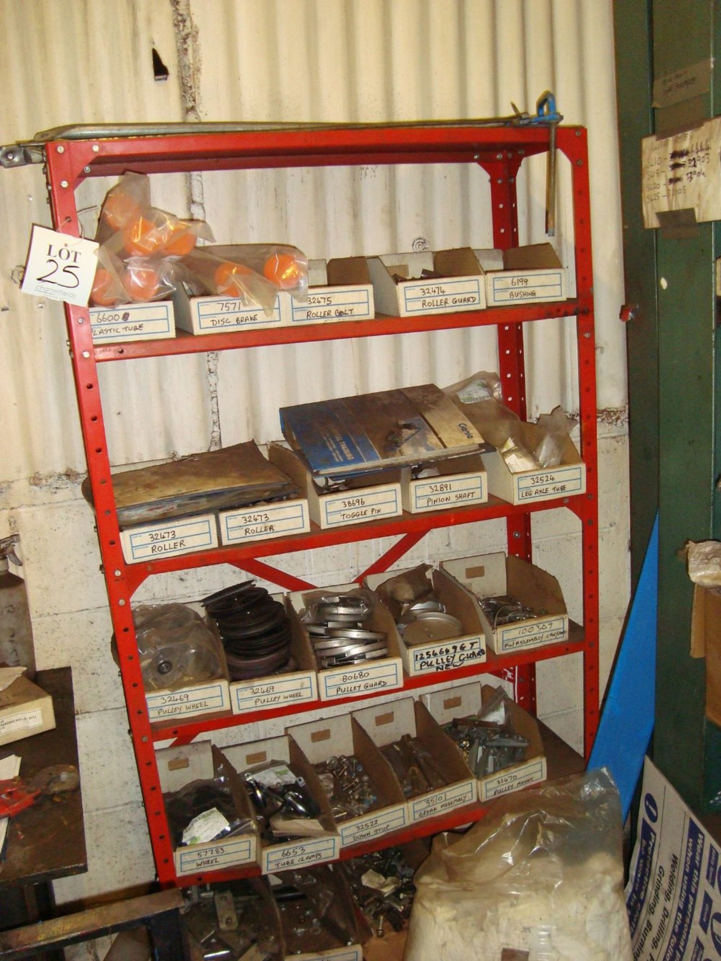 A rack of spare parts and a quantity of steel wire, as lotted