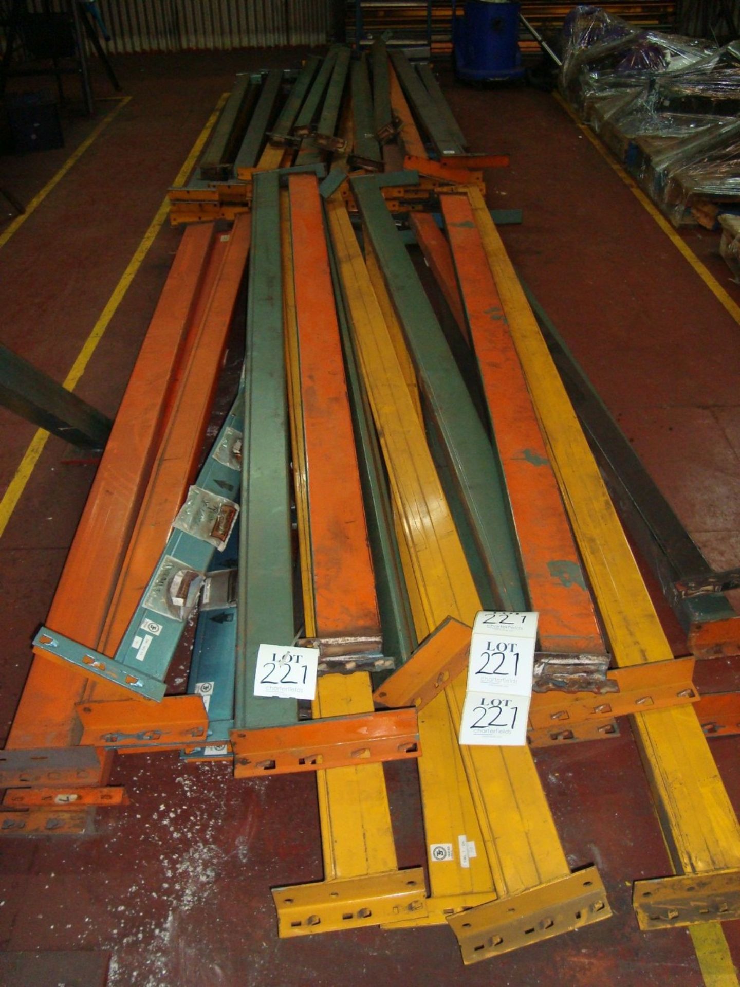 A quantity of dismantled pallet racking comprising various size and length uprights and cross beams