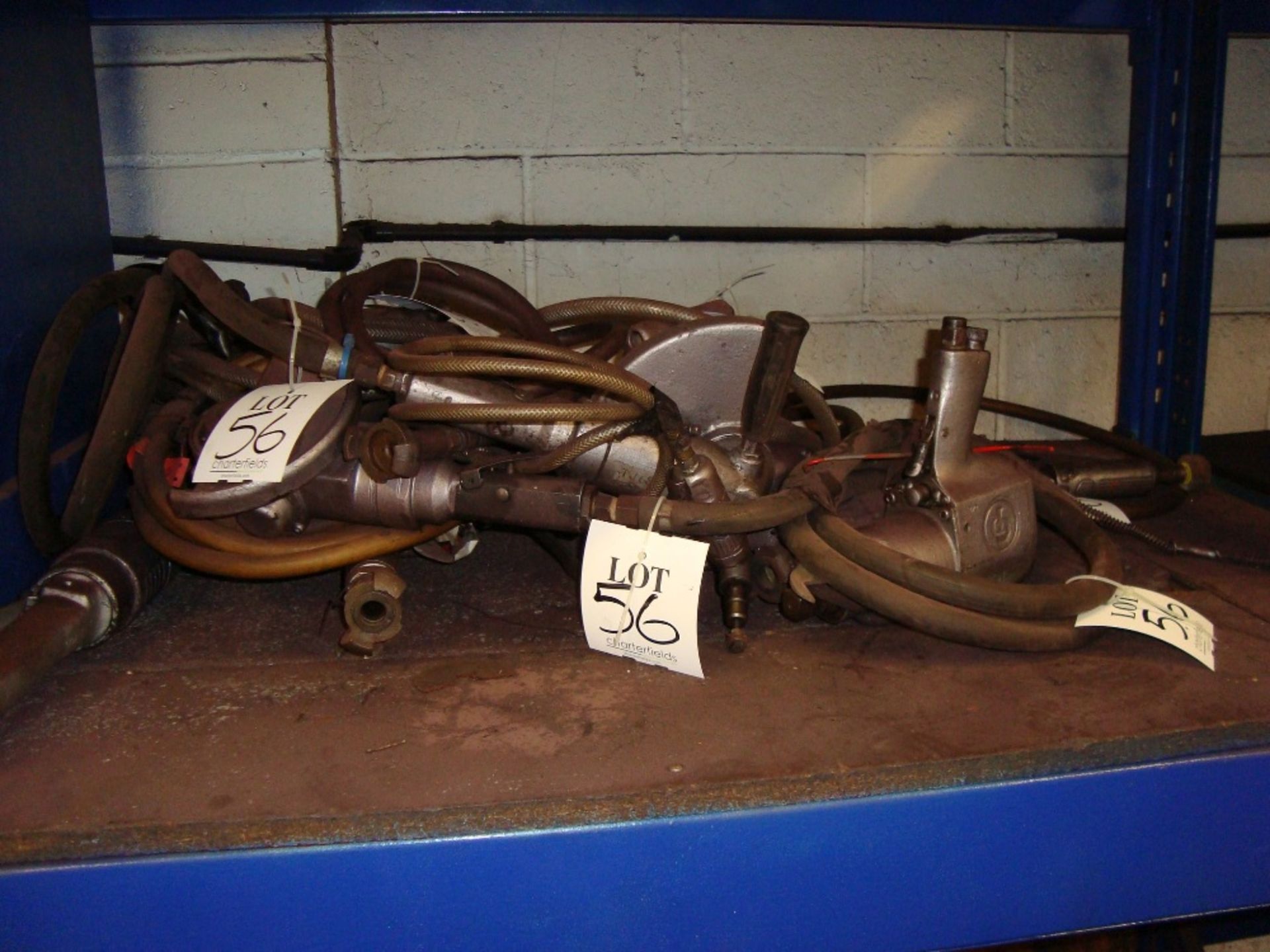 A quantity of pneumatic power tools, as lotted