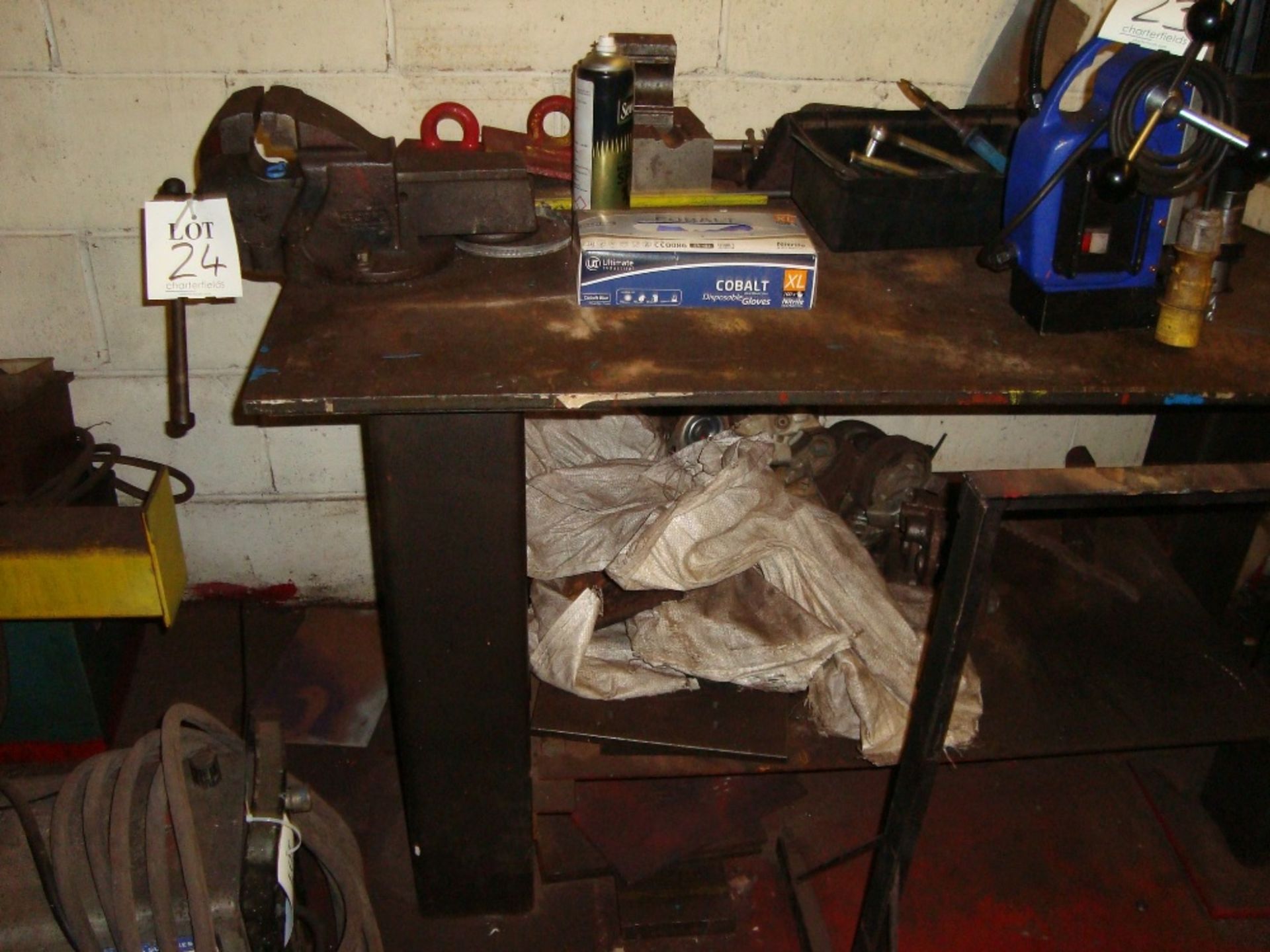 A steel workbench with Record No 4 vice and four various steel trestles, as lotted