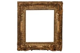 A FRENCH 18TH CENTURY LOUIS XV, FULLY CARVED AND GILDED FRAME