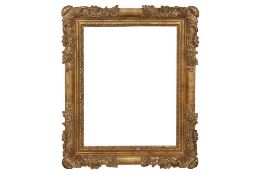 A FRENCH 17TH CENTURY STYLE CARVED AND GILDED LIMEWOOD LE BRUN FRAME