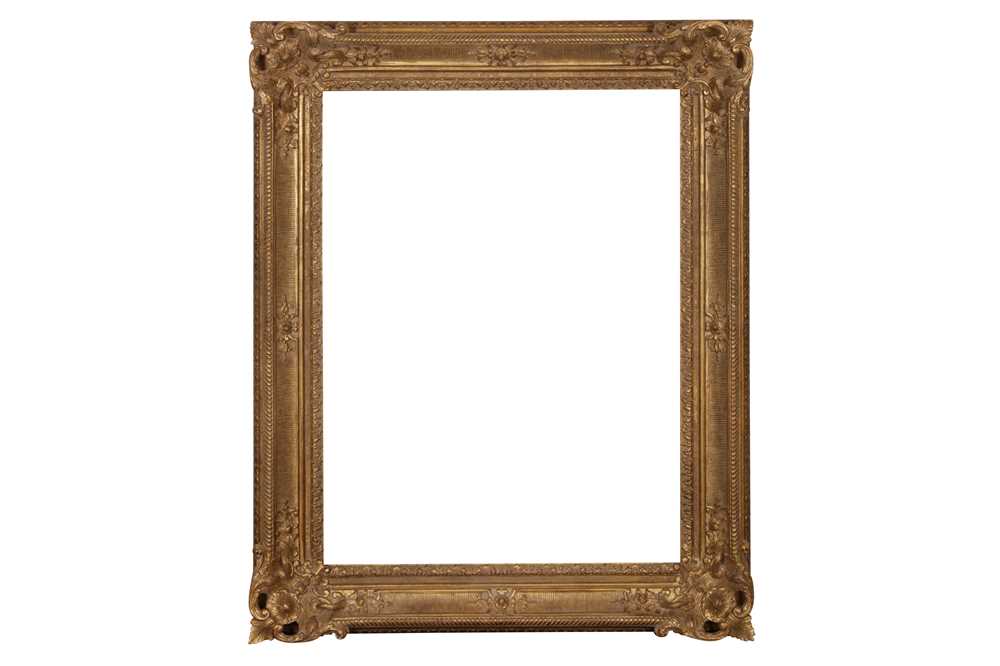 A FRENCH 17TH CENTURY STYLE LOUIS XIV CARVED GILDED LIMEWOOD FRAME