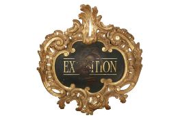 AN ITALIANATE CARVED AND GILDED LARGE BAROQUE CARTOUCHE FRAME