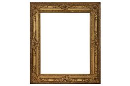 A FRENCH LOUIS XIV CARVED, PIERCED AND GILDED FRAME