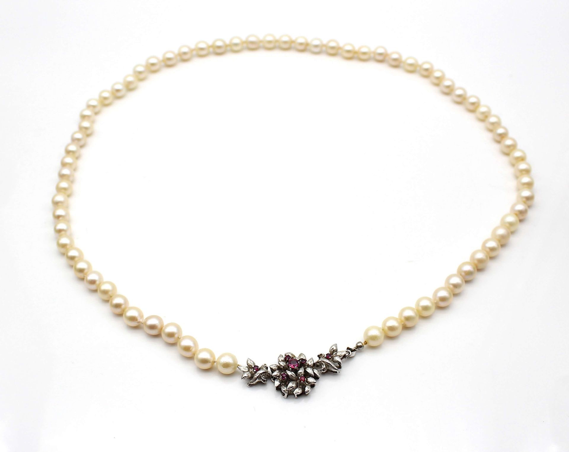 Cultured pearl necklace , white gold lock with rubies