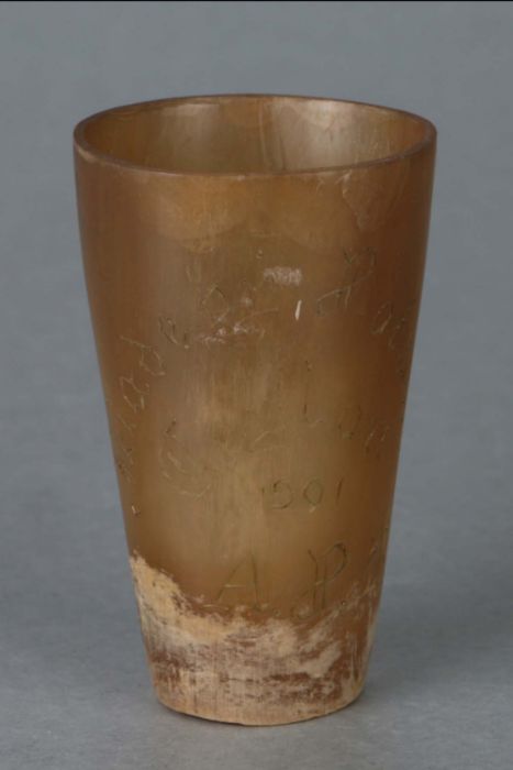 A Boer War trench art horn drinking cup engraved 'Ceylon 1901', 8cms high.