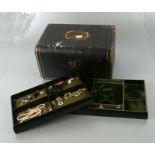 A large quantity of antique costume jewellery in a three-tier jewellery box to include a gold plated