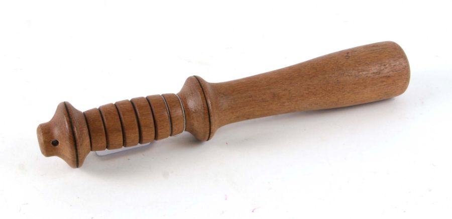 A short weighted cosh or truncheon. 26cms (10.25ins)