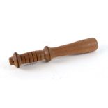 A short weighted cosh or truncheon. 26cms (10.25ins)