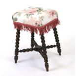 A Victorian oak stool on bobbin turned supports.