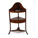 An early 19th century mahogany corner washstand, 54cms wide.