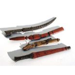 Four North African daggers of varying sizes. The longest blade is 28cms (11ins)