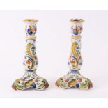 A pair of Quimper faience candlesticks, 23cms high (2).