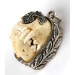 A Charivari - Bavarian hunting jewellery pendant, a full set of large polecat jaws set in a silver