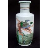 A Chinese famille rose rouleau vase decorated with dragons and an eagle, 45cms high.