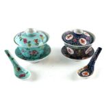 Two Chinese famille rose bowls and covers with matching stands and spoons, each 10cms diameter.
