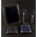 A group of silver plated photo frames, the largest 18 by 23cms (4).
