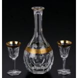 A Moser lead crystal decanter and two glasses with gilt decoration (decanter lacks stopper) (3).