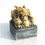 A large Chinese seal surmounted by a dragon, eight character mark to the matrix, 12cms high.