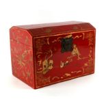 A Chinese red lacquer box and cover decorated with gilt figures within a landscape, 45cms wide.