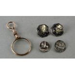 A gilt metal quizzing glass; together with four antique silver buttons (5).