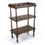 A Victorian rosewood three-tier Whatnot with barleytwist supports, 61cms wide.